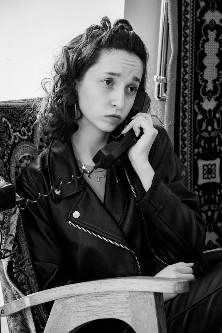 black and white portrait of woman on phone