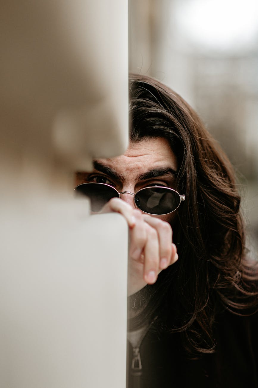 mysterious man peeking with sunglasses