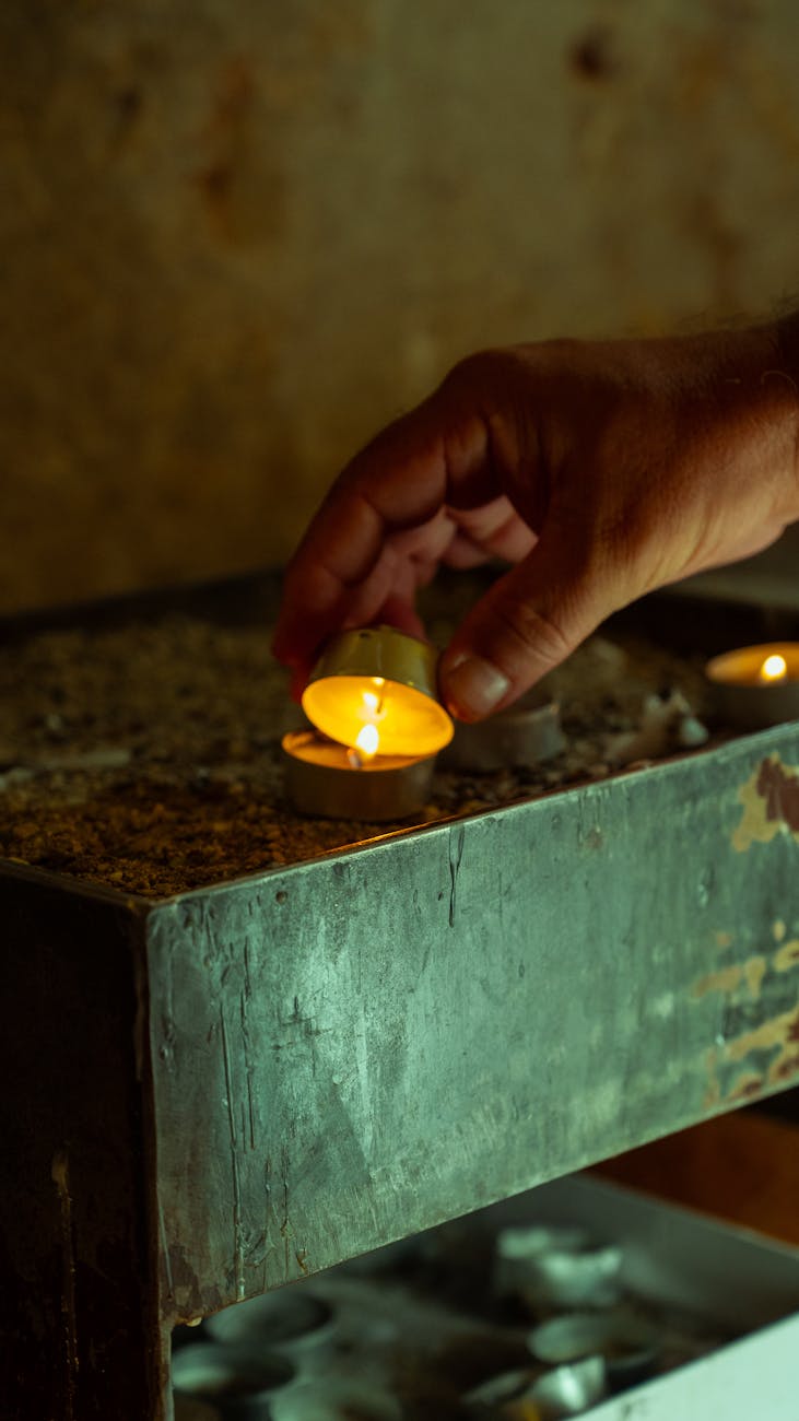 lighting a votive candle